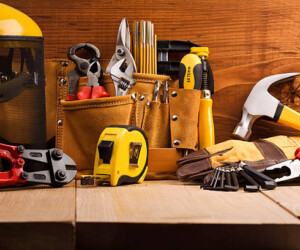 set of working tools on wooden boards