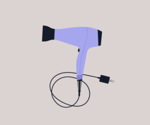 An isolated hair dryer with a cord, barbershop appliance